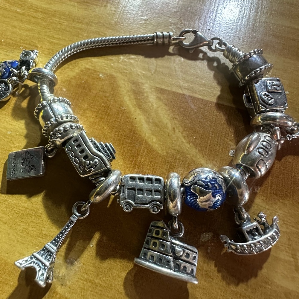 authentic Pandora Travelers charm bracelet. It’s a must have if u travel a-lot. - Picture 5 of 9